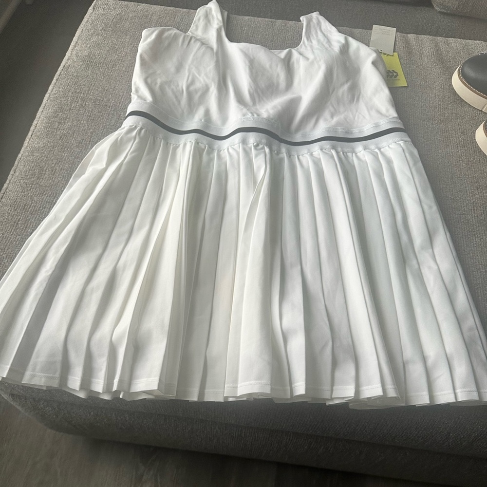 White Pleated Tennis Dress with Black stripe detail at Waistband